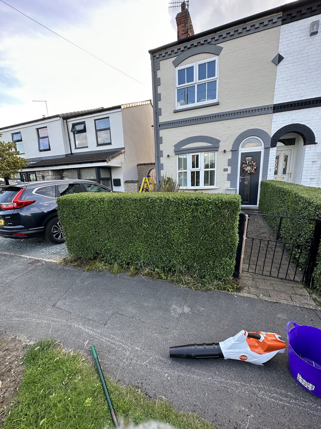 After — Front garden hedge before and after being cut back and shaped